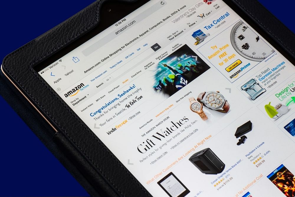 A tablet showing the Amazon home page, with a banner advertising gift watches