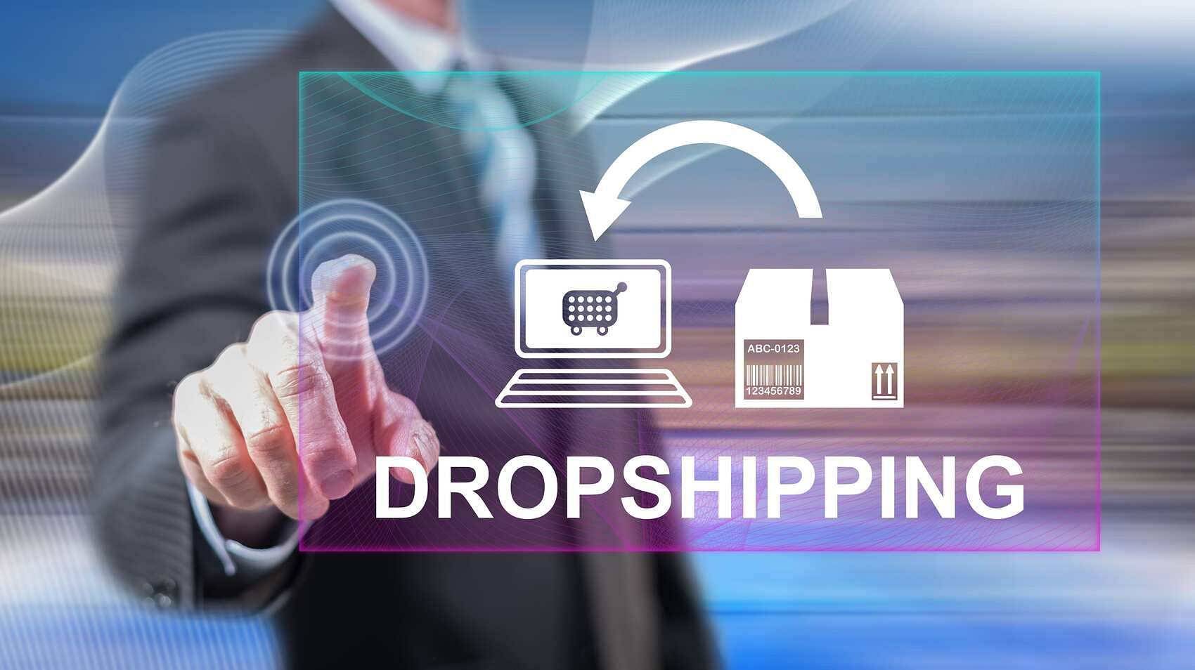 An image featuring a blurred background with a businessman in a half-body shot, touching a hologram of dropshipping, illustrating Amazon dropshipping guide