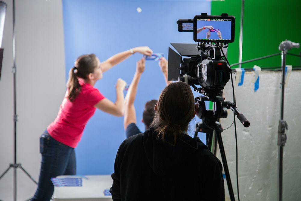 A team of three people shooting a product video
