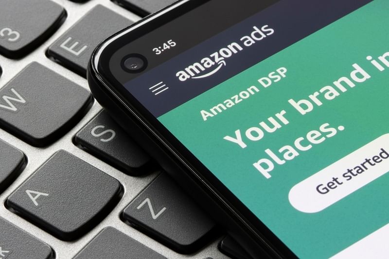 Amazon ads page on a mobile phone placed on top of a laptop keyboard