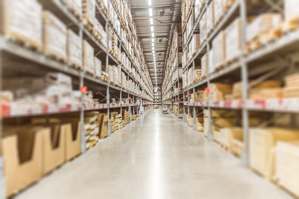 center view of a warehouse hallway illustrating an Amazon fulfillment center