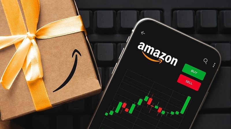 amazon icon, stocks chart on a mobile phone, an amazon gift, and a keyboard
