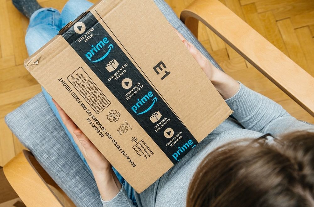 Woman holding an Amazon Prime package