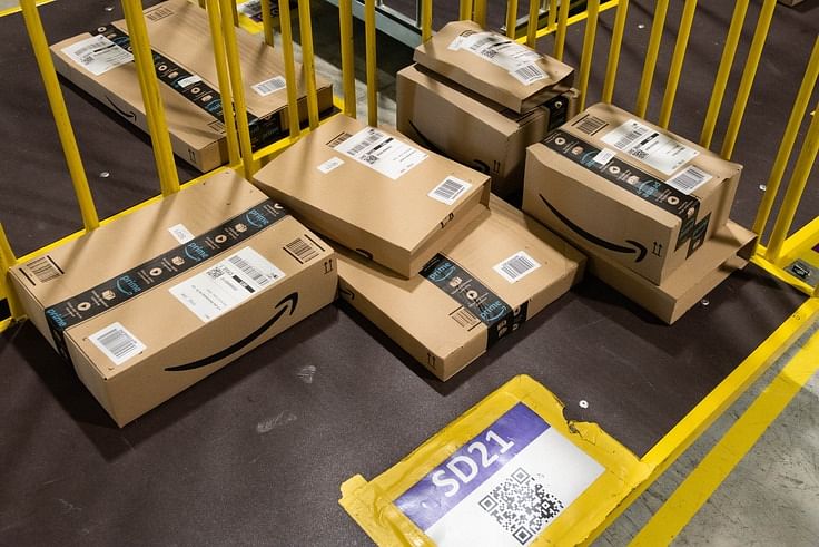 boxes of products with amazon’s smile logo and printed labels