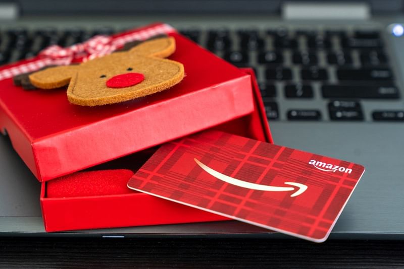 shot of an amazon giftcard inside a red box with a reindeer head design